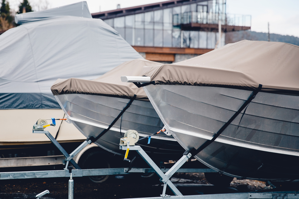 Boats with covers on them in storage