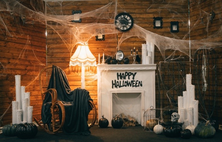 halloween decorations with spider webs and creepy chair