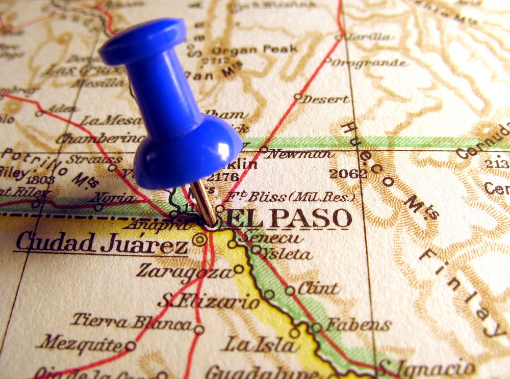 Words El Paso Texas on a map with a blue pin on it